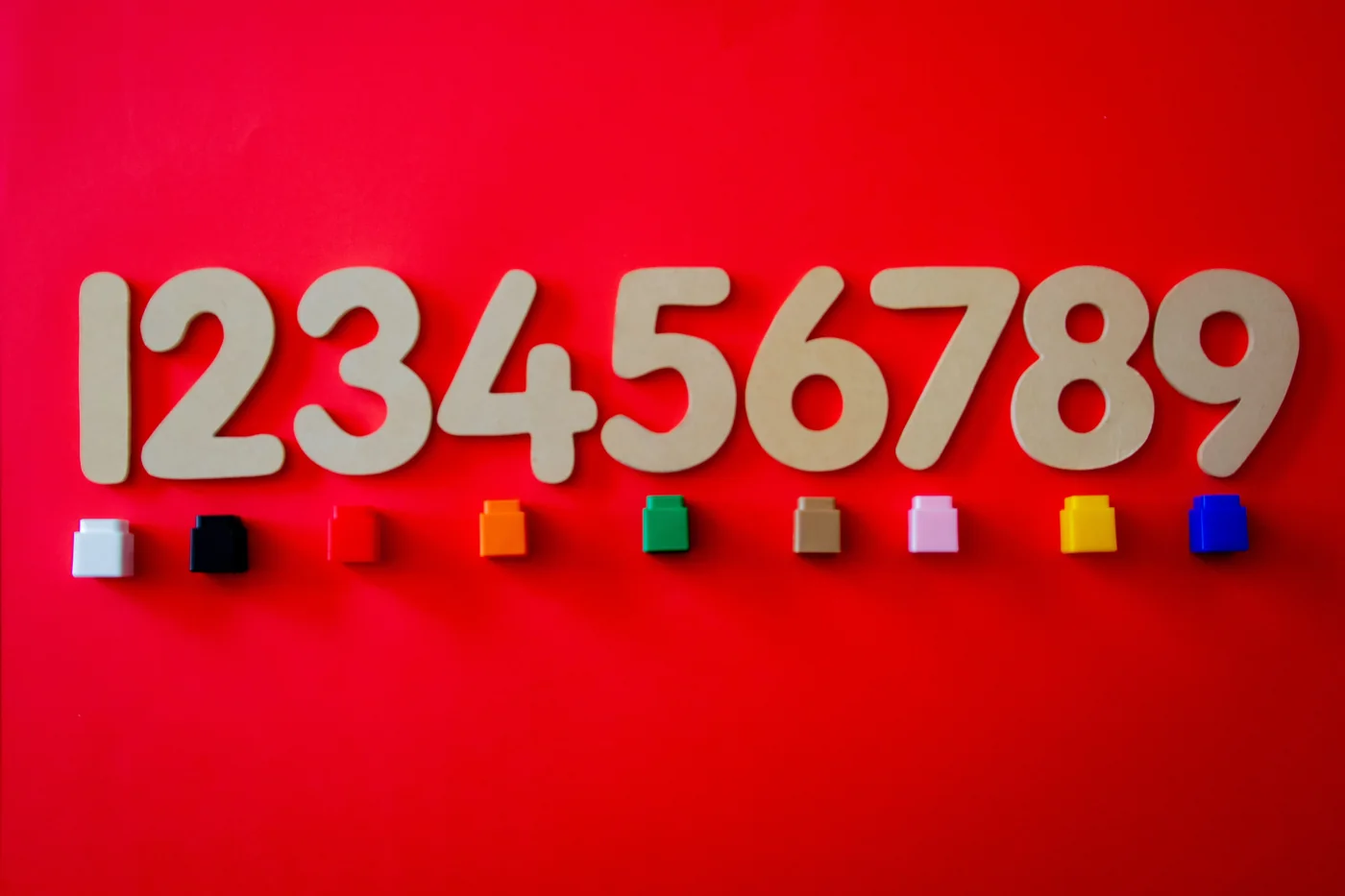 Wooden numbers and colorful blocks for playful number recognition